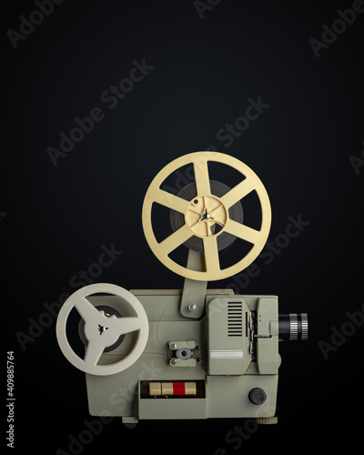 Vintage eight millimeters celluloid movie film projector on black background. Path included.