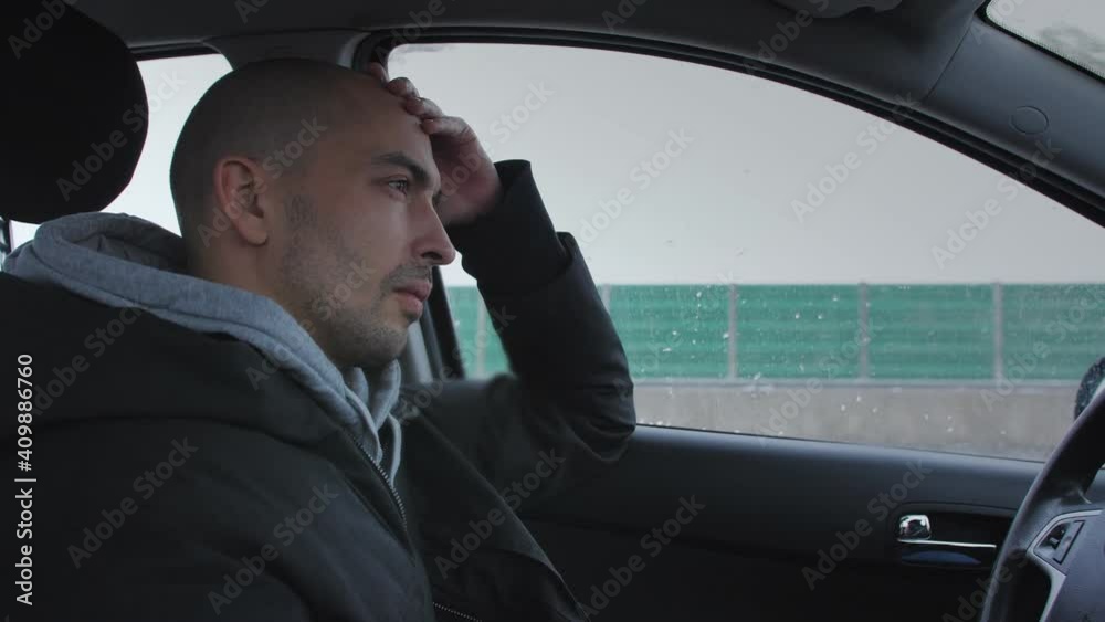 A man falls asleep from fatigue driving a car on the highway in winter. A man falls asleep from fatigue driving a car on the highway in winter.