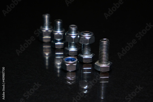 Bolts with nuts on 8mm on black background