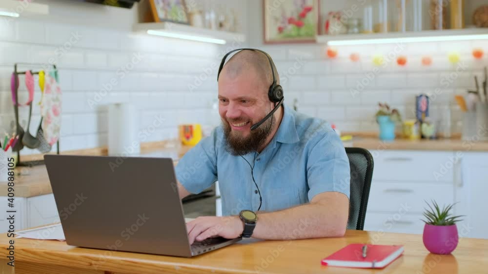 Cheerful mature man emotionally playing a game on his phone during work break while sitting at his workplace. He loses and shows a gesture of disappointment 4k Cheerful mature man emotionally playing a game on his phone during work break while sitting at his workplace. He loses and shows a gesture of disappointment 4k