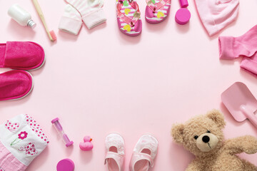 Baby girl accesories on pink background, baby shower concept