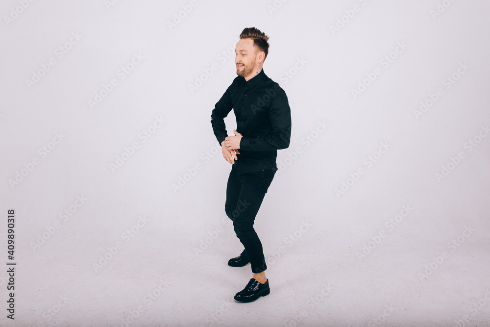 Happy young man dancing over white background Happy young man dancing over white background
