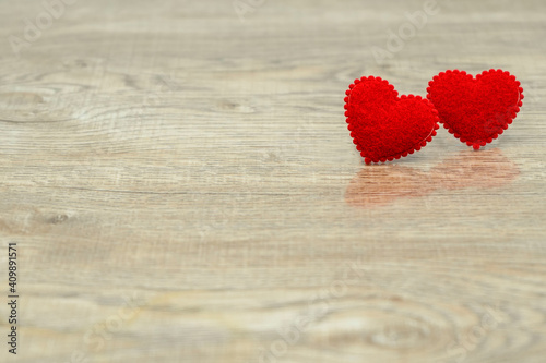 Two red love heart on wood texture background