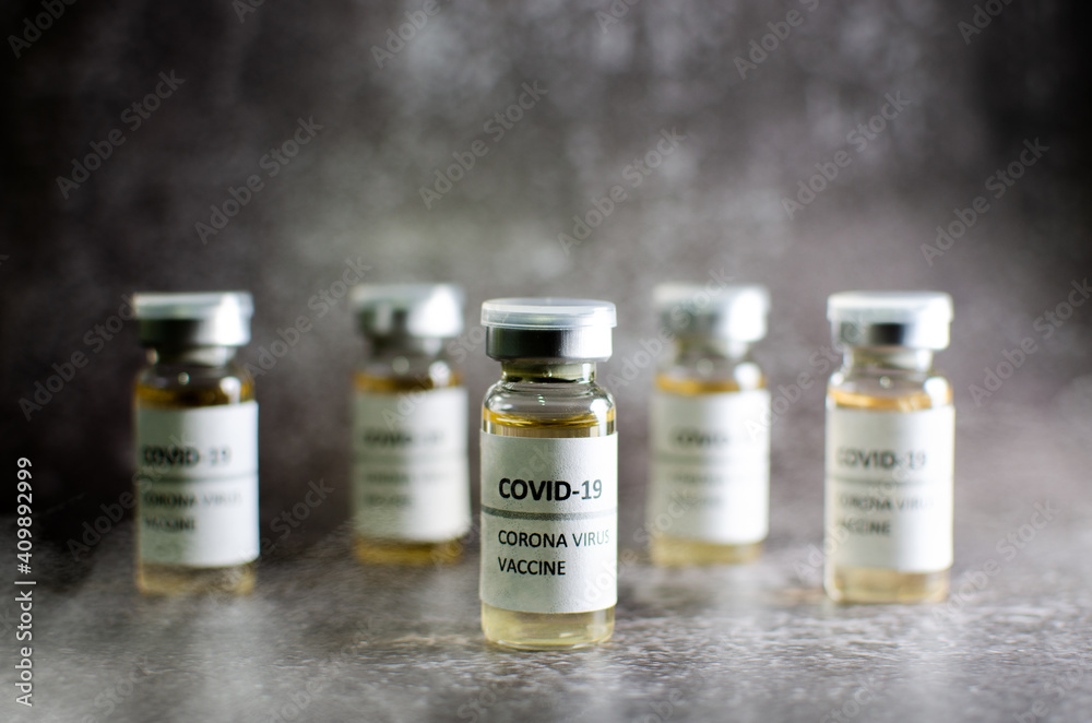 Coronavirus vaccine bottle isolated on white smoke background. Covid-19 situation disease pharmacy in laboratory and drug to cure people. Healthcare and Medical concept, Development of research. Coronavirus vaccine bottle isolated on white smoke background. Covid-19 situation disease pharmacy in laboratory and drug to cure people. Healthcare and Medical concept, Development of research.