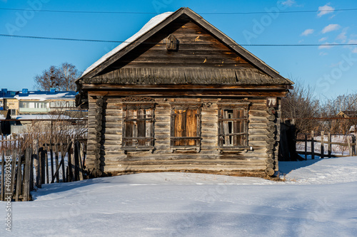 wooden house in the snow © Andrew