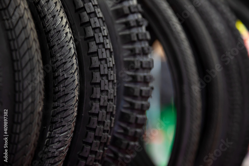 Bicycle tires in close-up. Tire texture. Black background. © Real_life