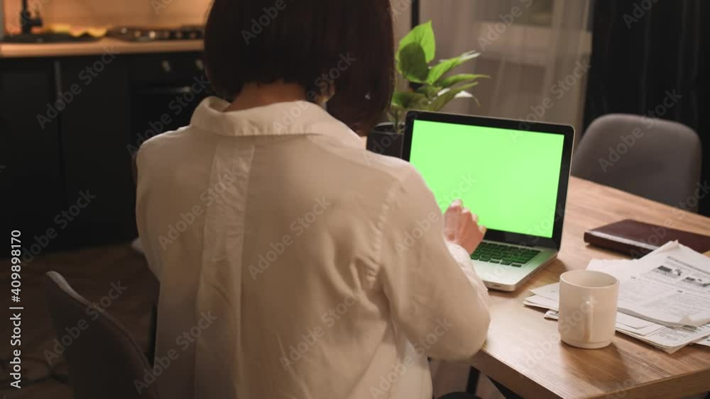 Caucasian businesswoman starts working on laptop green screen chromakey at home office. Girl hands typing on laptop green screen slow motion. Woman freelancer writing letter on laptop. Caucasian businesswoman starts working on laptop green screen chromakey at home office. Girl hands typing on laptop green screen slow motion. Woman freelancer writing letter on laptop.
