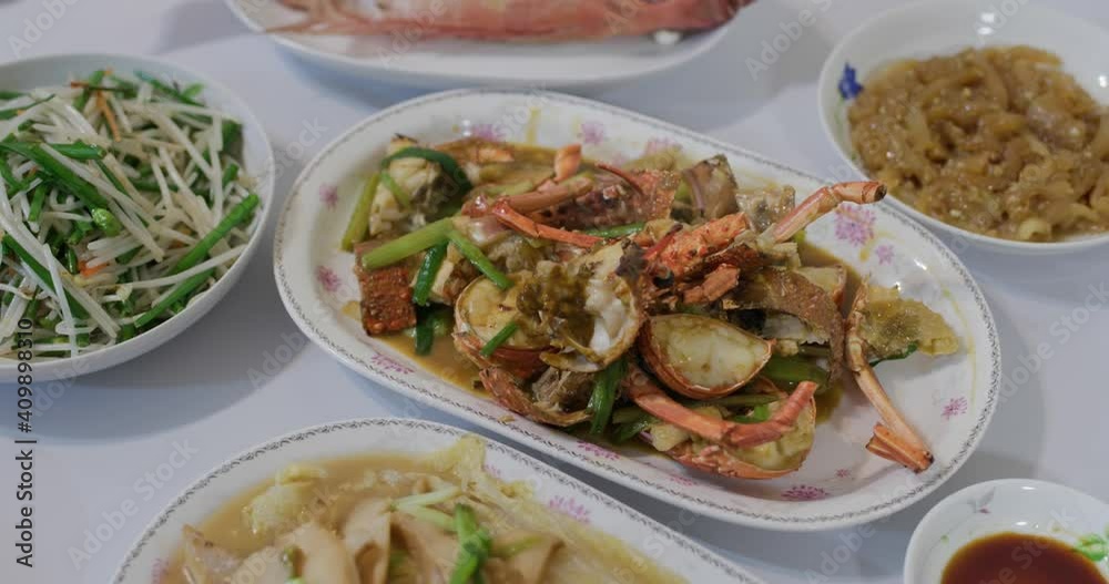 Steamed fish and lobster with roasted pork in chinese family homemade dinner Steamed fish and lobster with roasted pork in chinese family homemade dinner