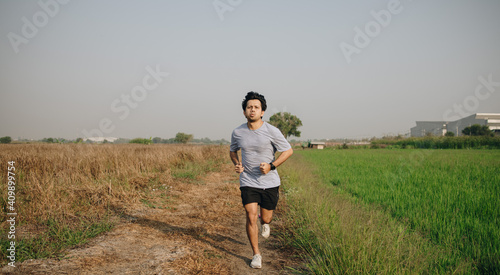 Athletic man with runner countryside in morning