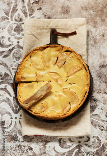 Homemade apple tart pie on wooden board, top view