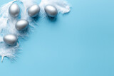 Silver Easter eggs on blue background. Top view decoration