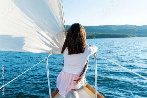 Young Woman Sitting on a Sailing Boat in the Sea .Woman on Yacht  © boryanam