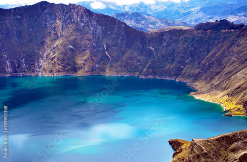 View of a water-filled crater lake and the most western volcano in the Ecuadorian Andes