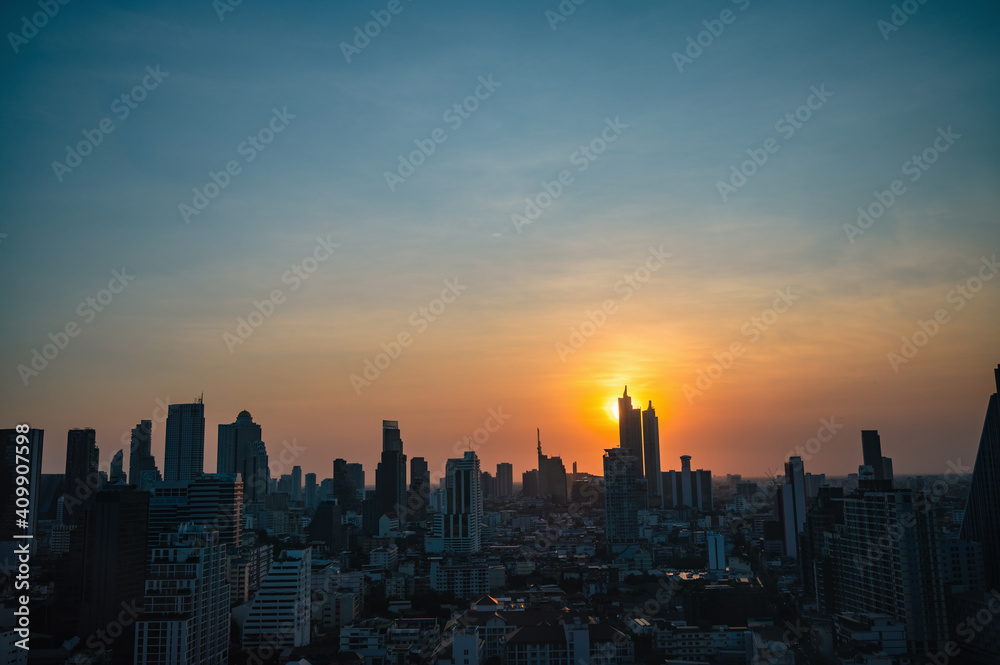 Fototapeta premium Bangkok Cityscape view with beautiful Sunset and silhouette of the building.Bangkok is the capital and most populous city of Thailand.