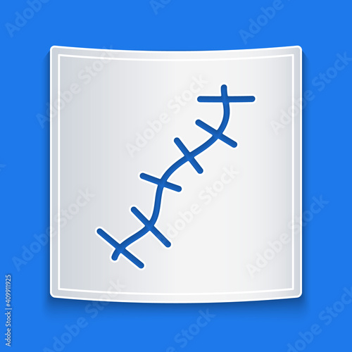 Paper cut Scar with suture icon isolated on blue background. Paper art style. Vector.