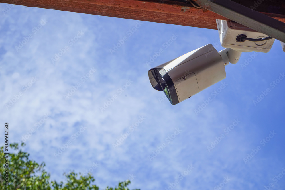 Dirty CCTV cameras are installed on the eaves for detecting property theft. CCTV security camera outdoors. Dirty CCTV cameras are installed on the eaves for detecting property theft. CCTV security camera outdoors.