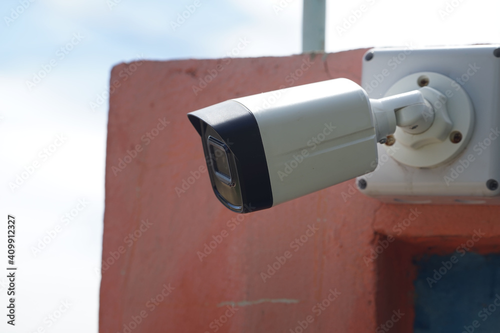 Dirty CCTV cameras are installed on the eaves for detecting property theft. CCTV security camera outdoors.