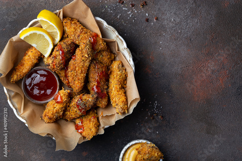 crispy Chicken strips with various dipping sauces