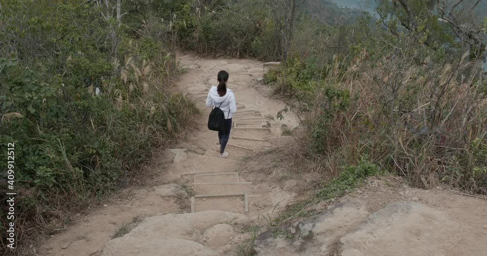 Woman go hiking and walk on the trekking Woman go hiking and walk on the trekking