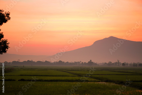 Golden morning sky in winter  misty high mountain background. Silhouette hills and misty in the morning at Chaiyaphum Thailand.
