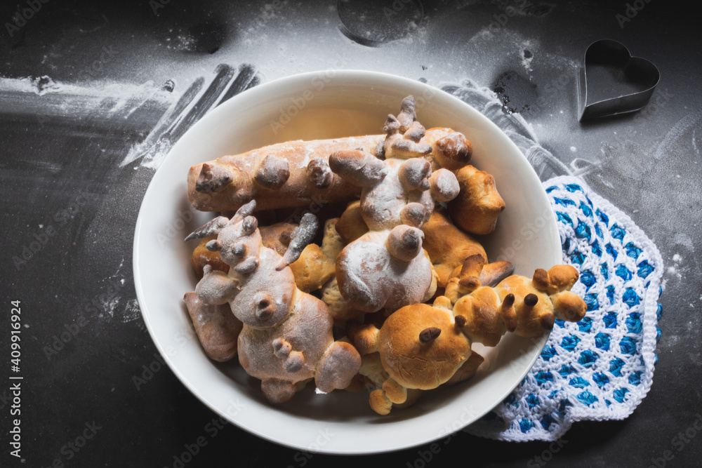 Kids activity with bread dough, baked snowman and other figures Kids activity with bread dough, baked snowman and other figures
