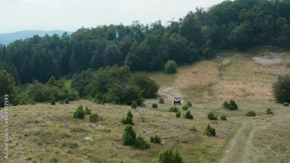 Aerial view of mountain in autumn and offroad vehicle on the dusty road. Mucanj, Serbia Aerial view of mountain in autumn and offroad vehicle on the dusty road. Mucanj, Serbia