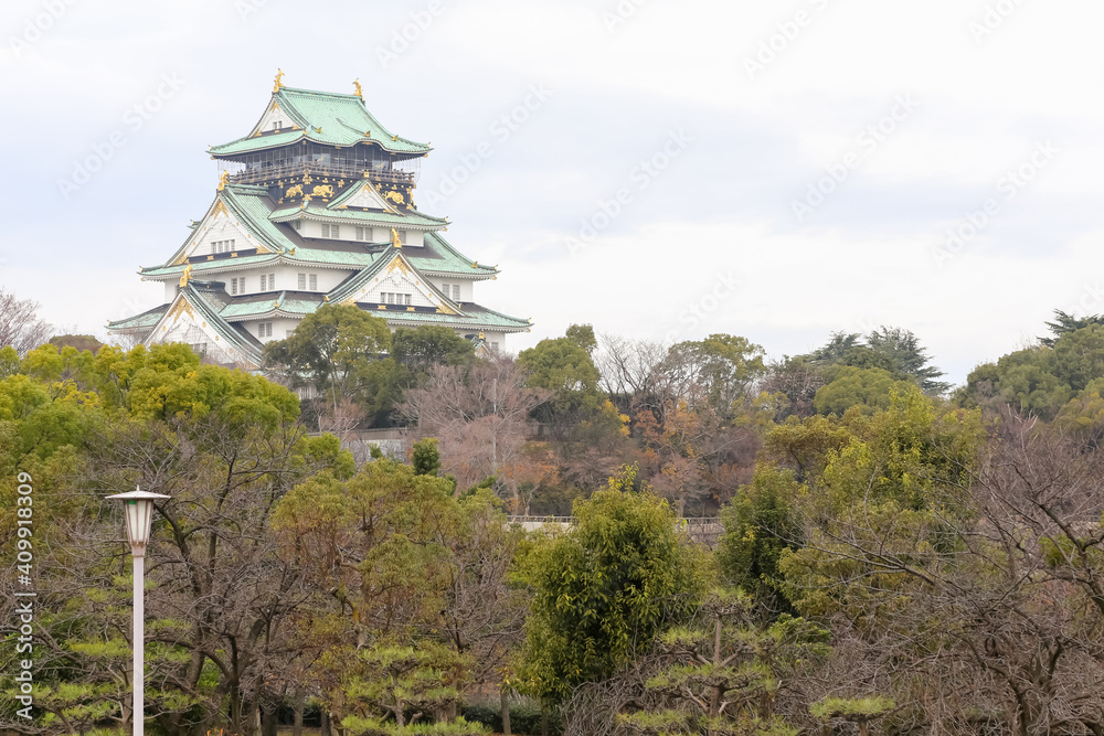 A low angle view looking towards the Osaka Castle below, around the city. A low angle view looking towards the Osaka Castle below, around the city.