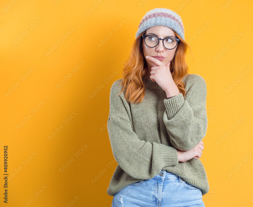 Suspect concept. Distrustful young woman, isolated on white background