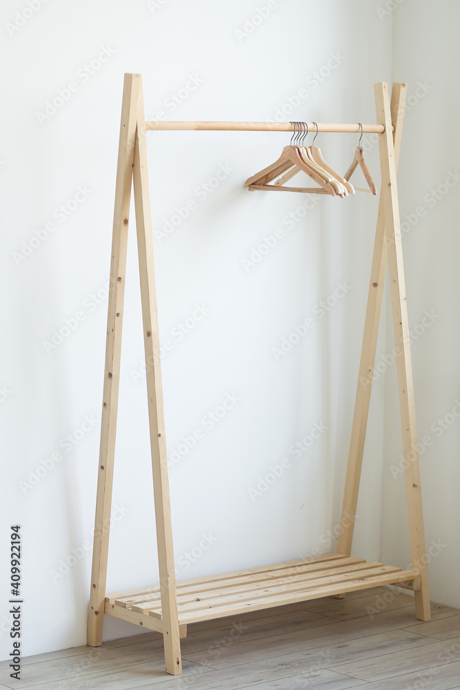 empty clothes hangers hanging on a clothes rack in the bedroom. copy spase empty clothes hangers hanging on a clothes rack in the bedroom. copy spase