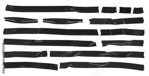 Black electrical tape, set of stripes of torn sticky pieces of different shapes, isolated objects on white background photo
