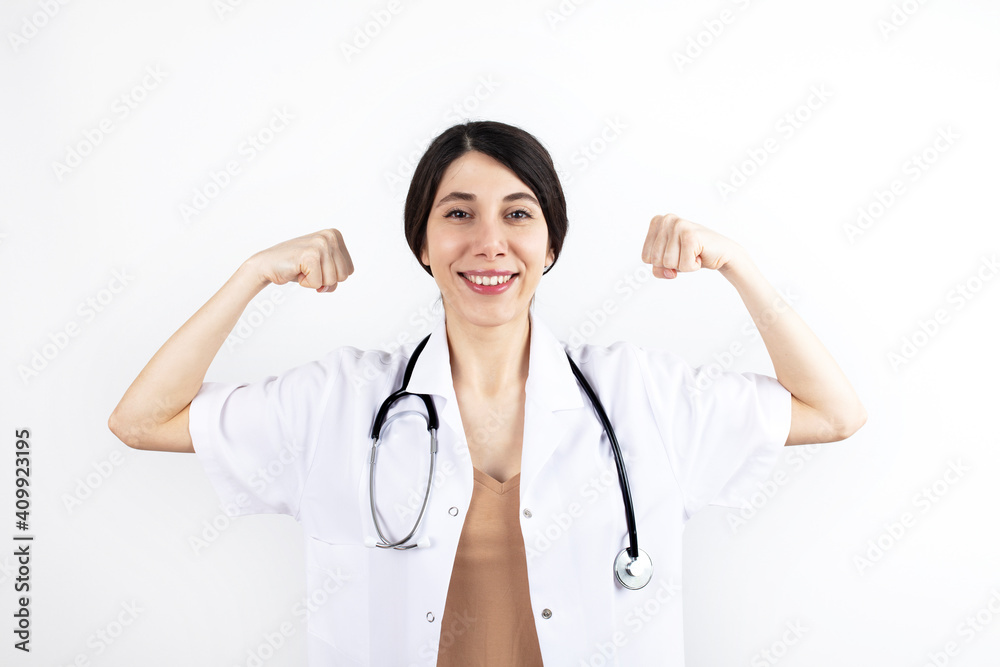 young doctor woman wearing medical uniform over isolated background Strong person showing arm muscle, confident and proud of power.
young doctor woman wearing medical uniform over isolated background Strong person showing arm muscle, confident and proud of power.