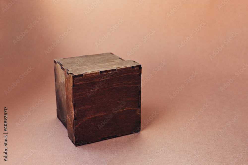 Fototapeta premium Wooden gift box on color background.