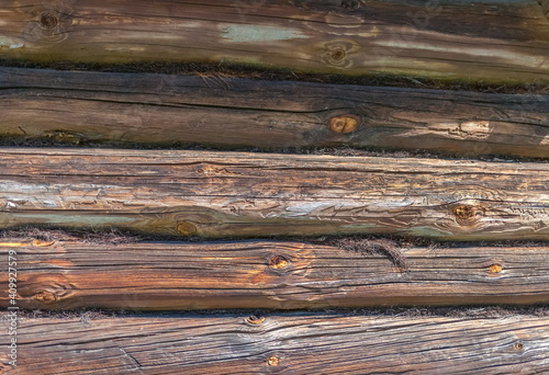 Old log wall of a wooden village house