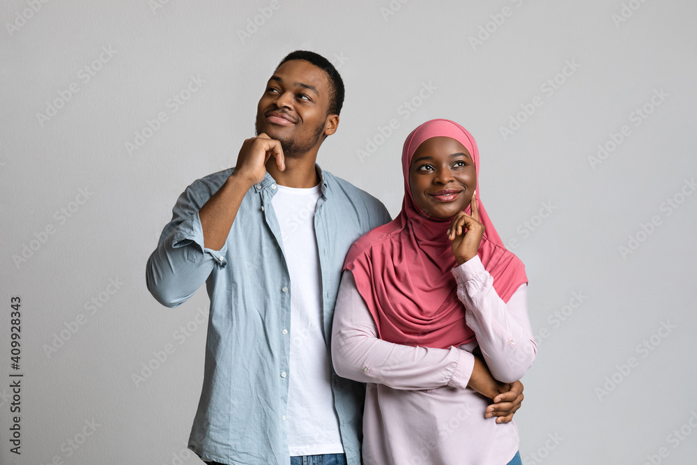 African american lovers dreaming about something on grey African american lovers dreaming about something on grey