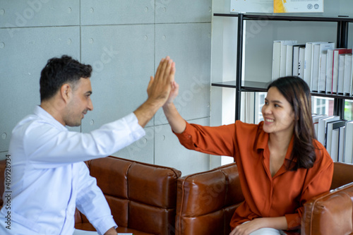 Medical doctor Psychologist in healing session with young Asian woman depressed mental sickness patient in the clinical office