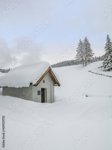 The chapel for St. Antonius during the ski touring in the mountains and forest above Alvaneu in the Swiss Alps © gdefilip