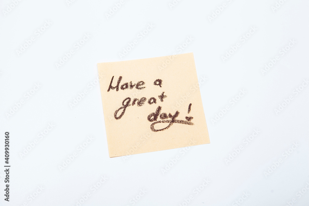 Have a great day message handwritten on yellow post-it note Have a great day message handwritten on yellow post-it note