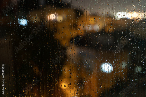 rain on window and lights of the torches