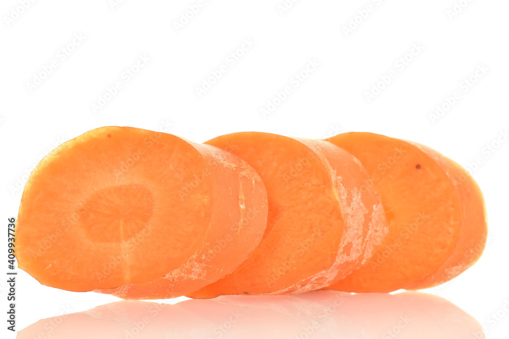 Three slices of fresh organic, unpeeled carrots, close-up, isolated on white. Three slices of fresh organic, unpeeled carrots, close-up, isolated on white.