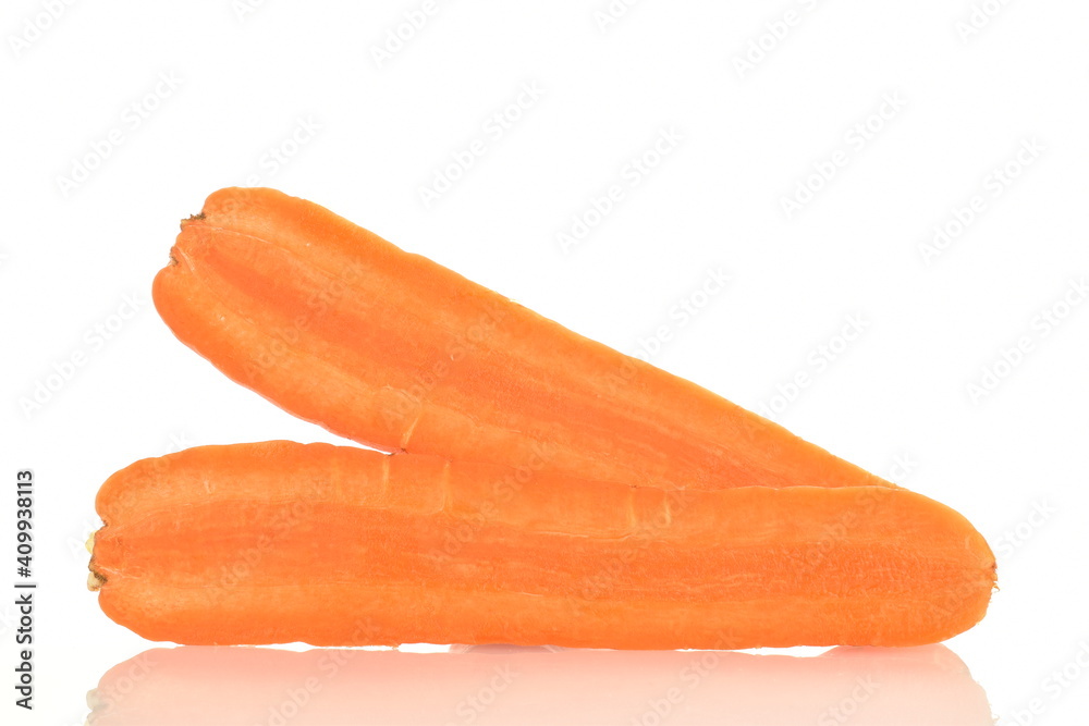 One ripe organic, unpeeled carrot, cut in half, close-up, isolated on white. One ripe organic, unpeeled carrot, cut in half, close-up, isolated on white.
