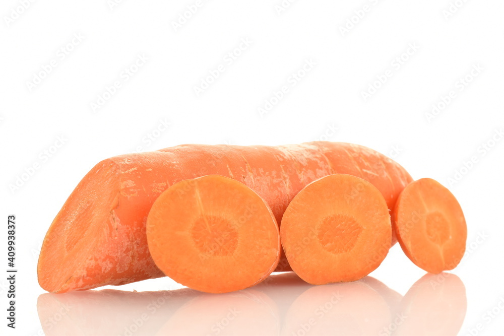 One fresh organic, unpeeled carrot cut into slices, close-up, isolated on white. One fresh organic, unpeeled carrot cut into slices, close-up, isolated on white.