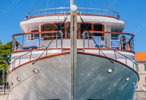 Yacht anchor close-up seen on the front of a large boat. Sailboat bow parked in harbor, yachting, sailing