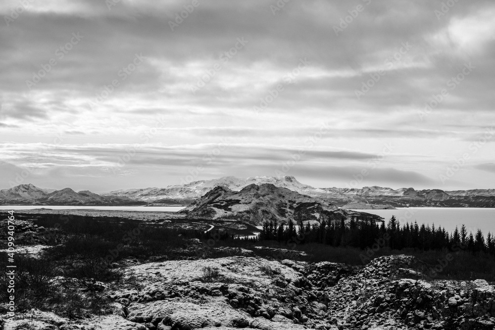 View over the fault line between the North American and Eurasian continental plates on Lake þingvallavatn with the small peninsula of Mjóanes and the island of Sandey in Þingvellir National Park . View over the fault line between the North American and Eurasian continental plates on Lake þingvallavatn with the small peninsula of Mjóanes and the island of Sandey in Þingvellir National Park .