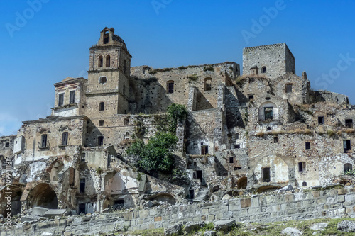 landscape of the ghost town of Craco, with abandoned houses in ruins due to a landslide