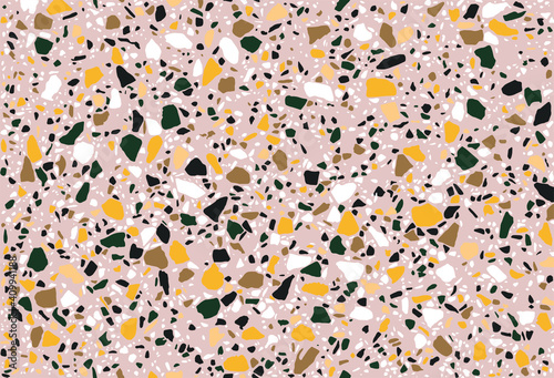 Seamless repeating terrazzo pattern in green, yellow, black and white on a pastel pink background. Trendy and stylish composite stone texture, wallpaper, web background, fabric design.