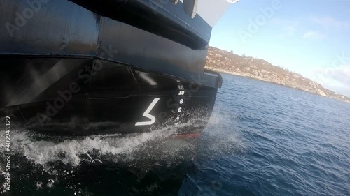 Ships bow efficiently cutting through crispy seawater - Slow motion MF Hjellestad aluminum battery ferry photo