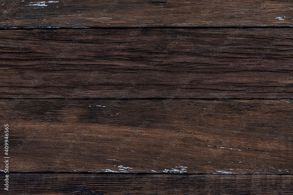 Naklejka premium Background from the old in cracks boards of brown color.