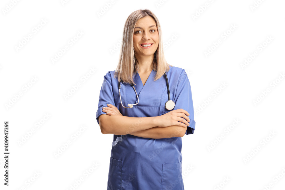 Female health care worker in a blue uniform smiling at camera Female health care worker in a blue uniform smiling at camera