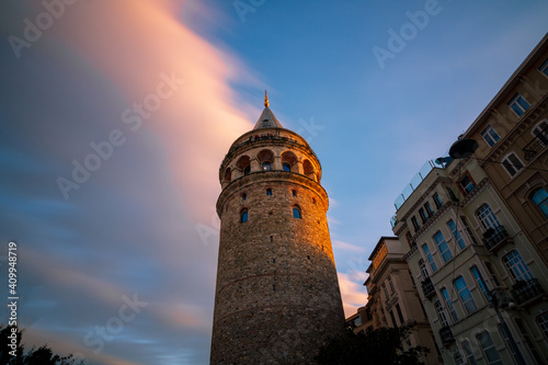 long exposure photo of Galata Tower at sunset with motions of clouds. Galata Tower background photo. Travel to Istanbul. Istanbul background photo.