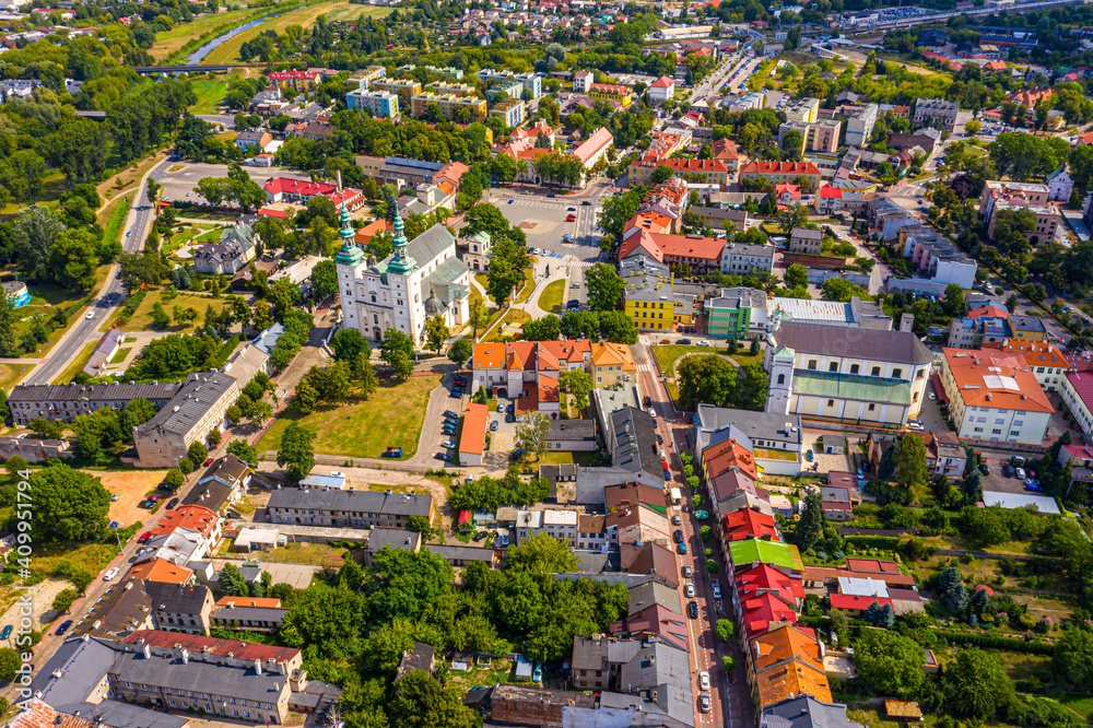 Top aerial panoramic view of Lowicz old town historical city centre with Rynek Market Square, Old Town Hall, New City Hall, colorful buildings with multicolored facade and tiled roofs, Poland Top aerial panoramic view of Lowicz old town historical city centre with Rynek Market Square, Old Town Hall, New City Hall, colorful buildings with multicolored facade and tiled roofs, Poland